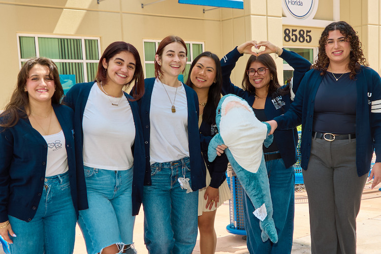 Group of students gathering outside building