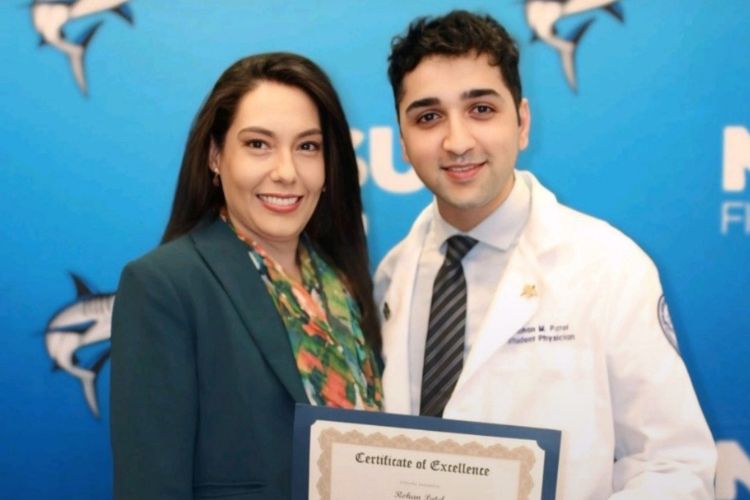 Public health students holding certificate