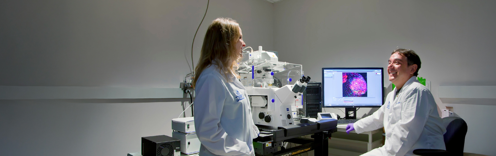 Two NSU researchers talking in a lab