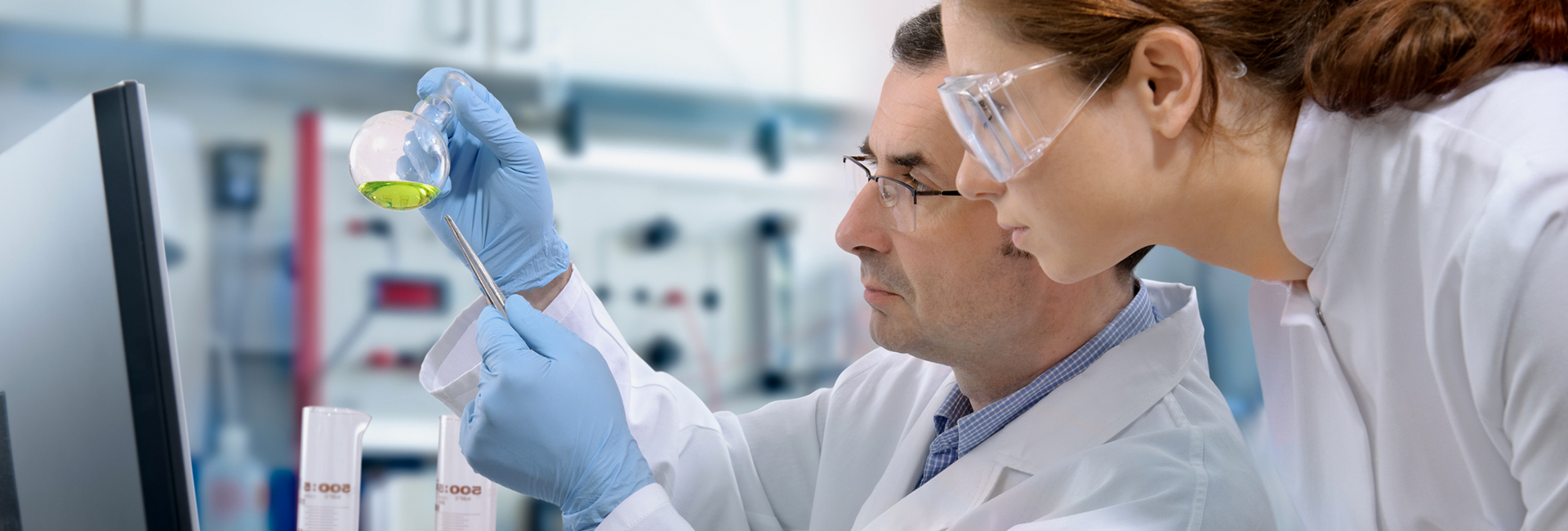 Researchers analyzing samples in a lab