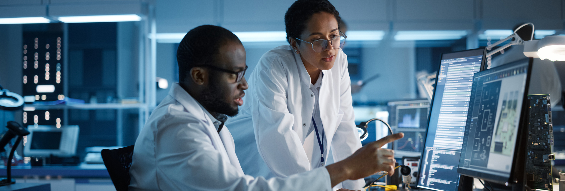 Team of researchers looking at data on their computer