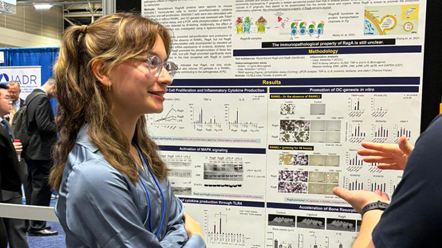 Maria Castellon talking to a colleague
