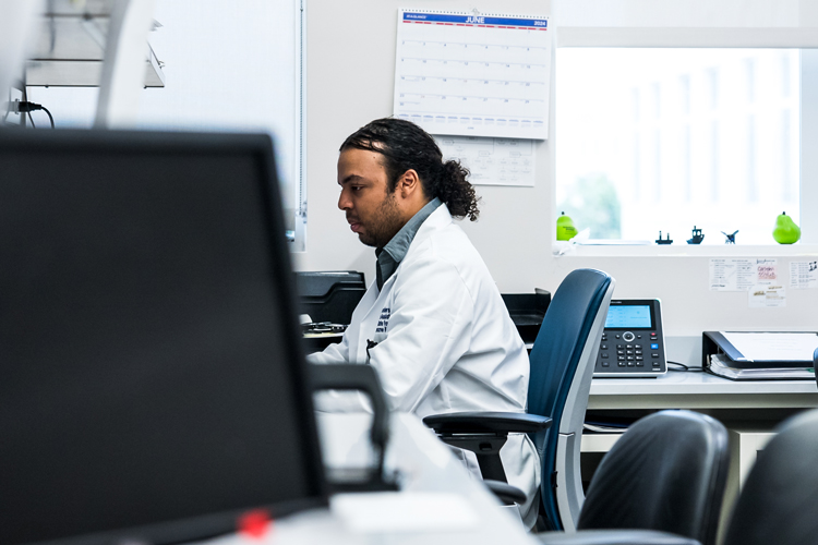 NSU member at the lab using computer
