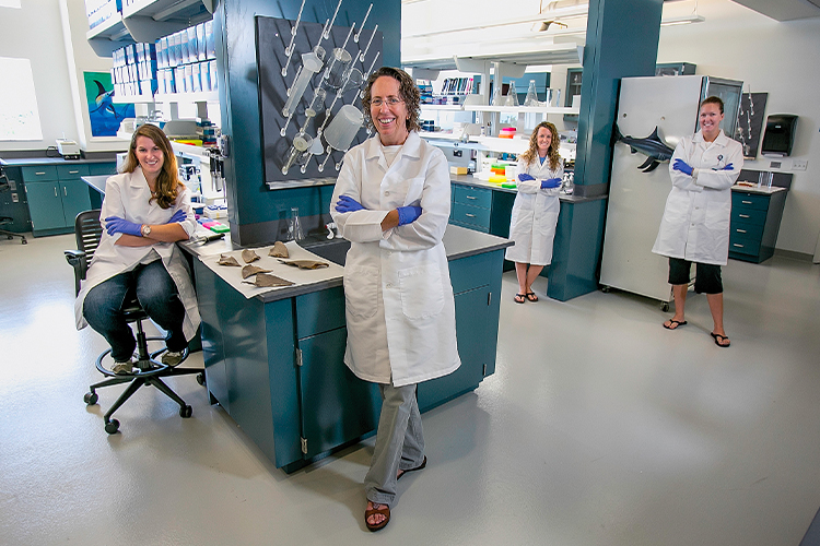 NSU research team in a lab posing for the camera