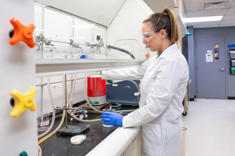 NSU scientist using lab equipment