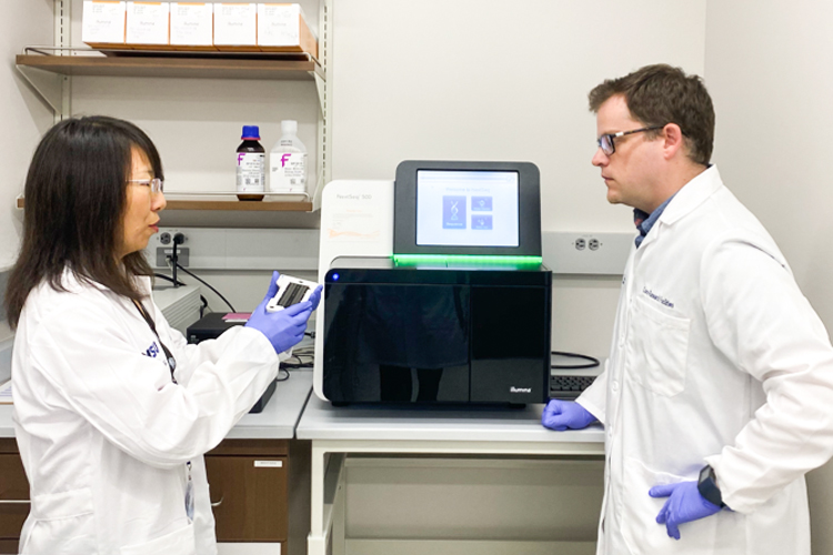 Professionals using equipment at the lab