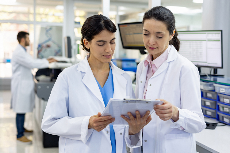 Researchers reading test results in the laboratory