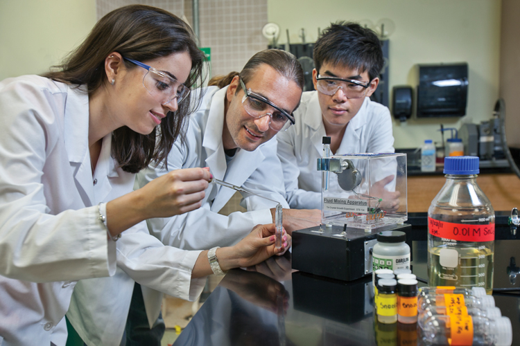 Researchers students working on lab