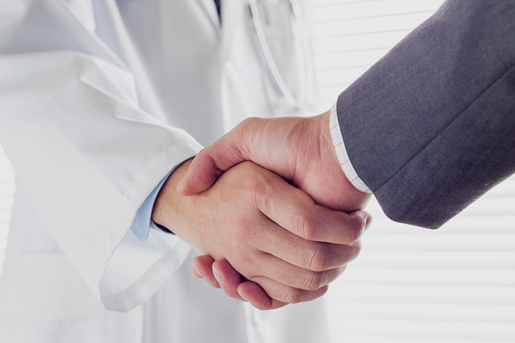 Scientist and man shaking hands