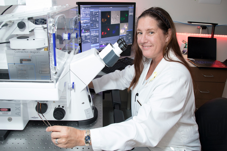 Scientist at imaging core facility
