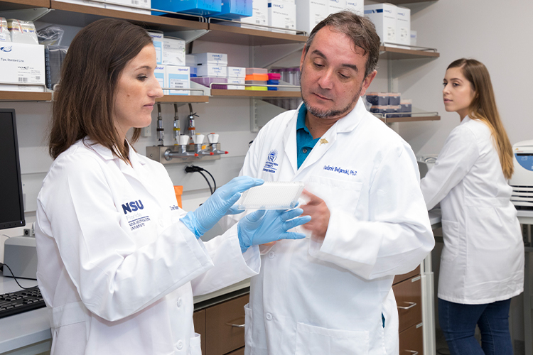 Team of NSU scientists working in a lab