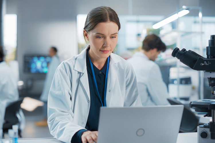 Woman using a laptop in the lab