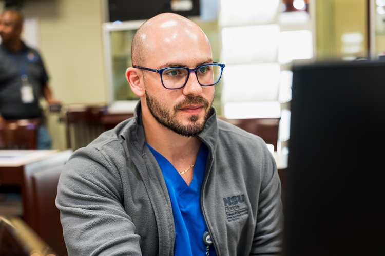 Graduate student using computer
