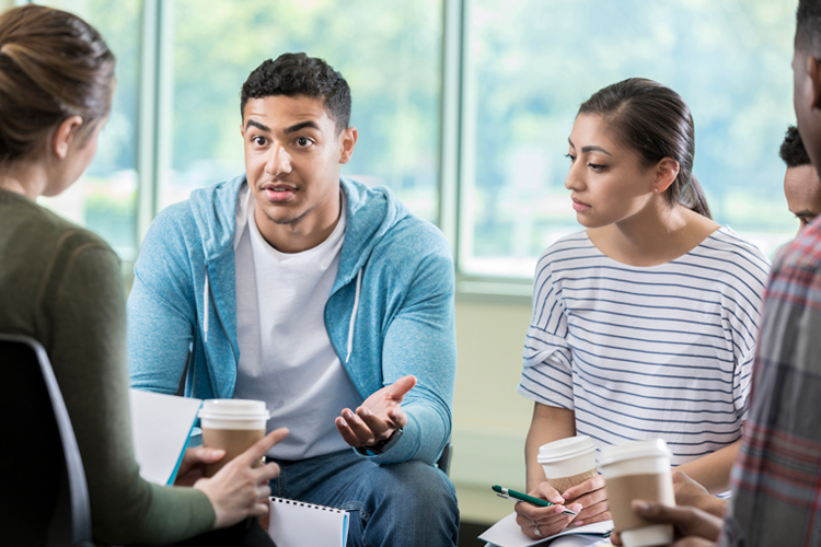 Group of students talking in a meeting