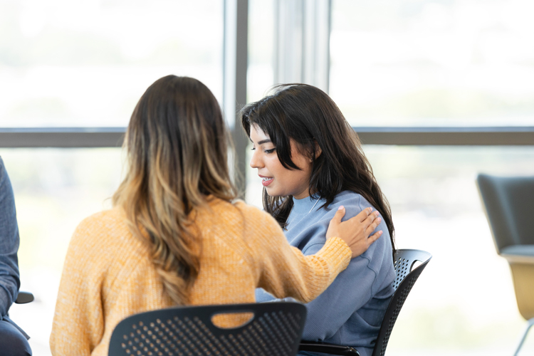 Suicide prevention  student getting help speaking to someone