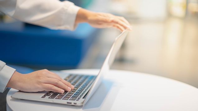 Virtual experiences for transfer student opening laptop