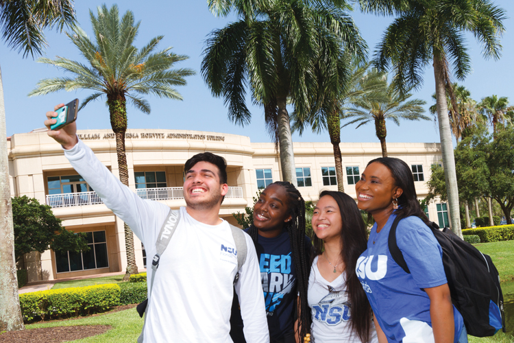 Freshman students taking selfie on first day of school