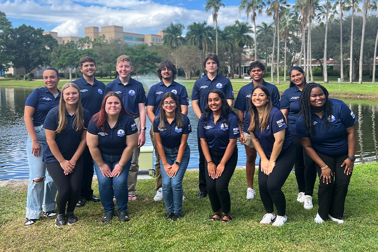 NSU dual admission ambassadors pose for a picture outdoors