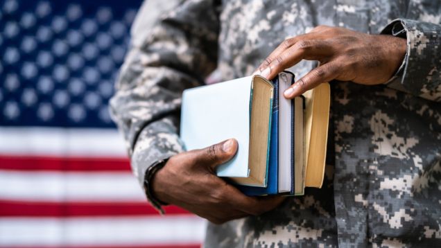 man holding books