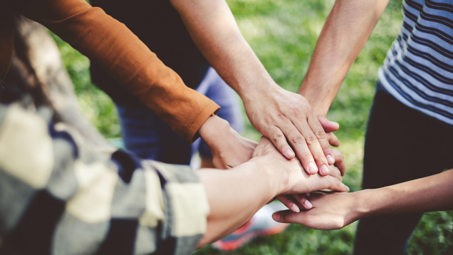Stacking hands working together