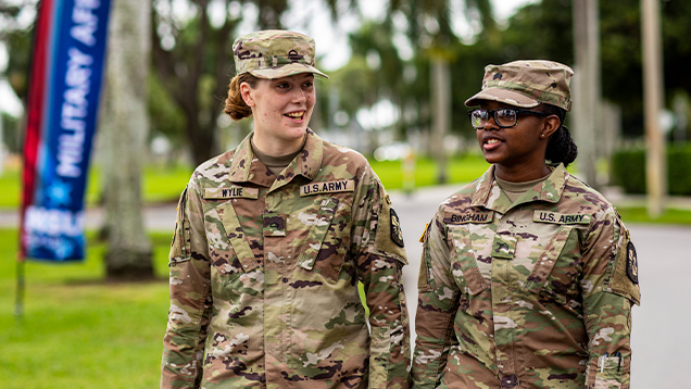 United States Army soldiers talking outside of NSU campus