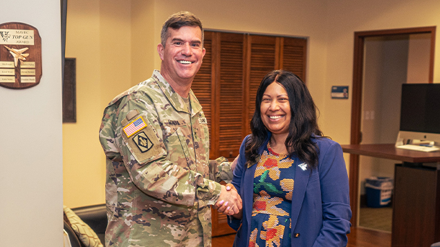 Veteran and woman shaking hands