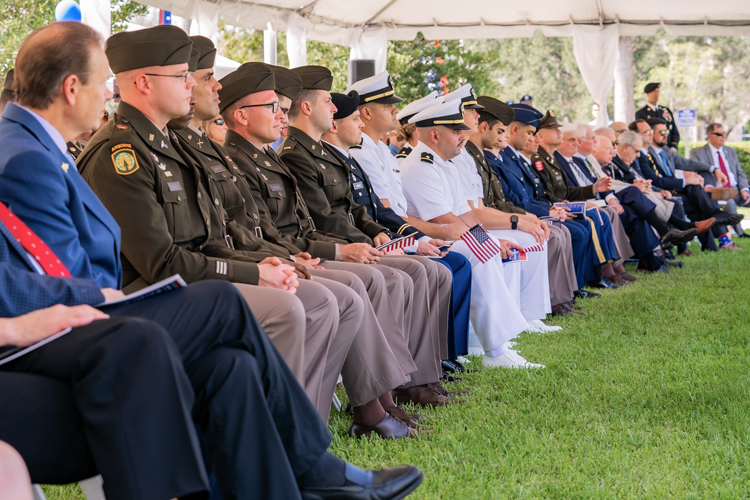 People with uniforms at military affairs pinning ceremony