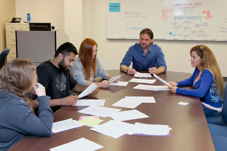 Group of people talking in a workshop