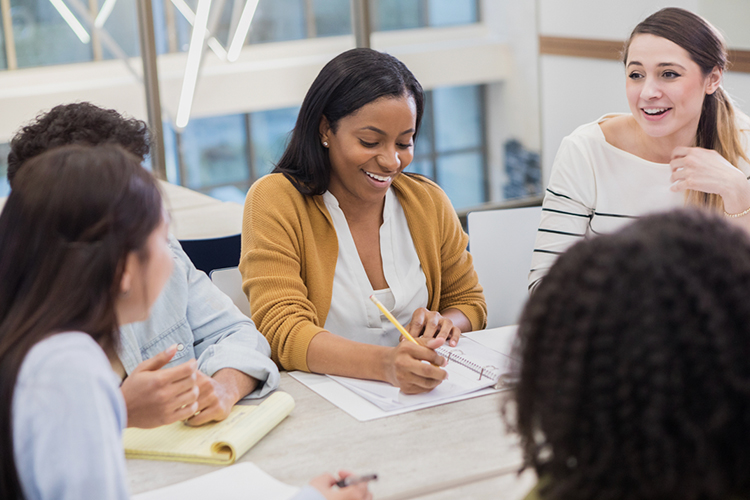 Group of students taking notes during a brainstorming session