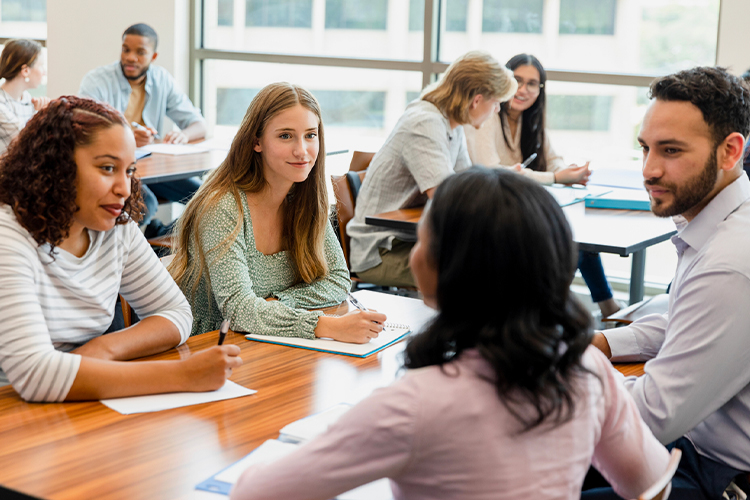 Group of students working together and taking notes