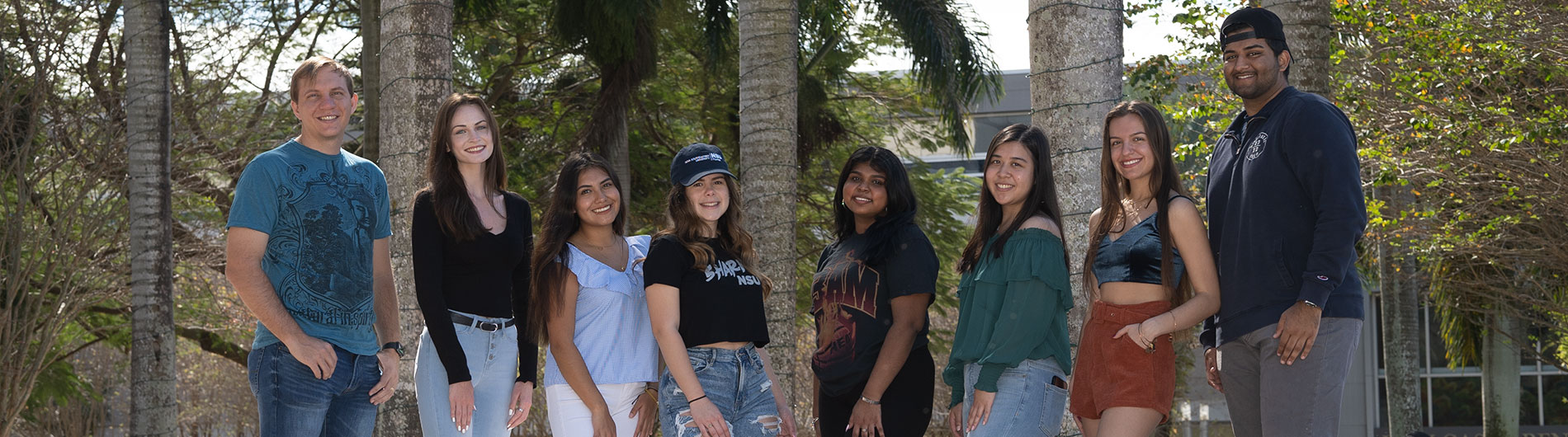 diverse group of students smiling at camera