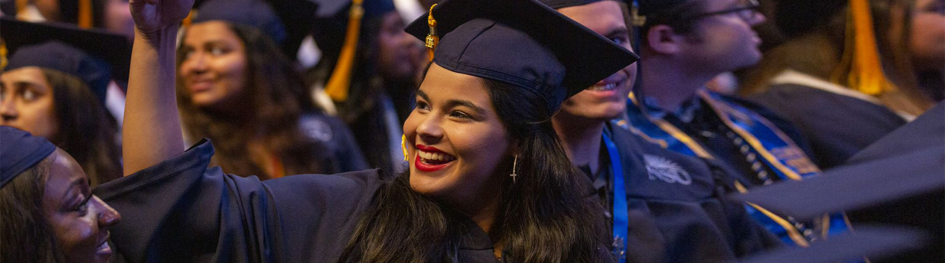 smiling students at commencement