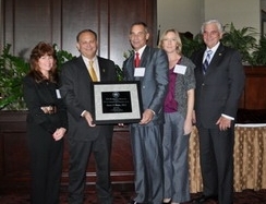 Steven Kurtz, Ph.D., DAIS, receives Provost's Scholarship and Research Award from Provost Frank DePiano.