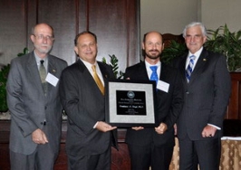 Bernhard Riegl, PhD, Oceanographic Center, receives Provost's Scholarship and Research Award from Provost Frank DePiano.