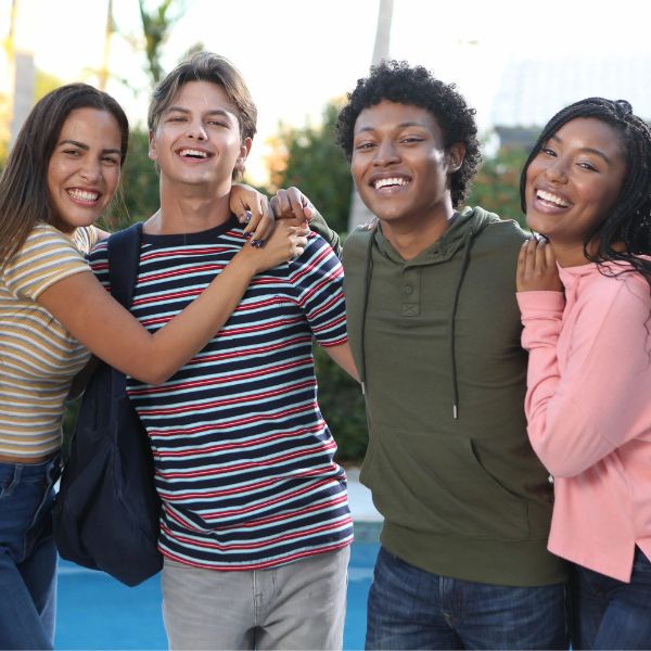 4 students laughing together