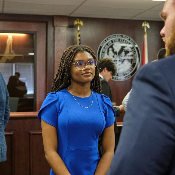 female law student speaking with professor