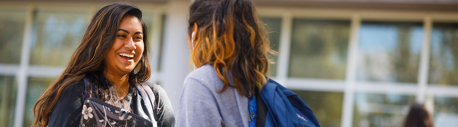 two female students talking outside