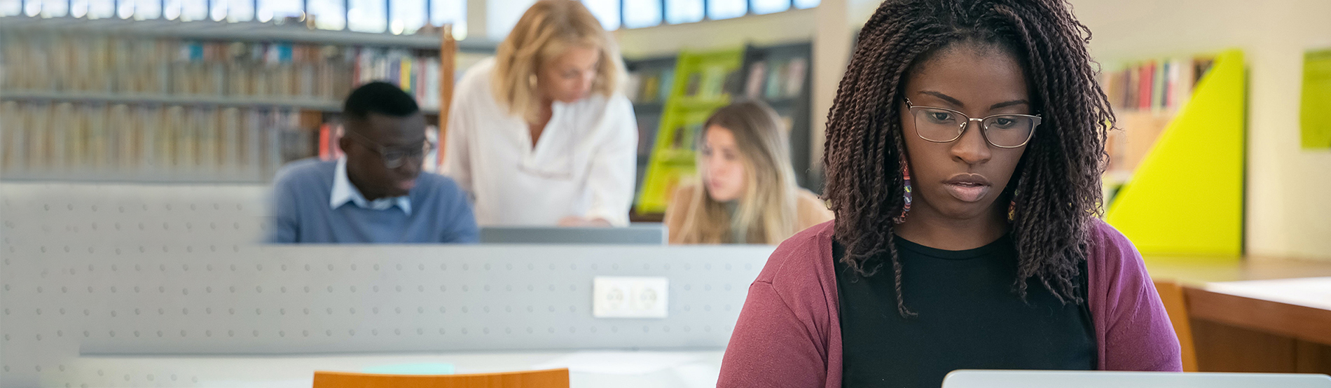 female student focussing on laptop