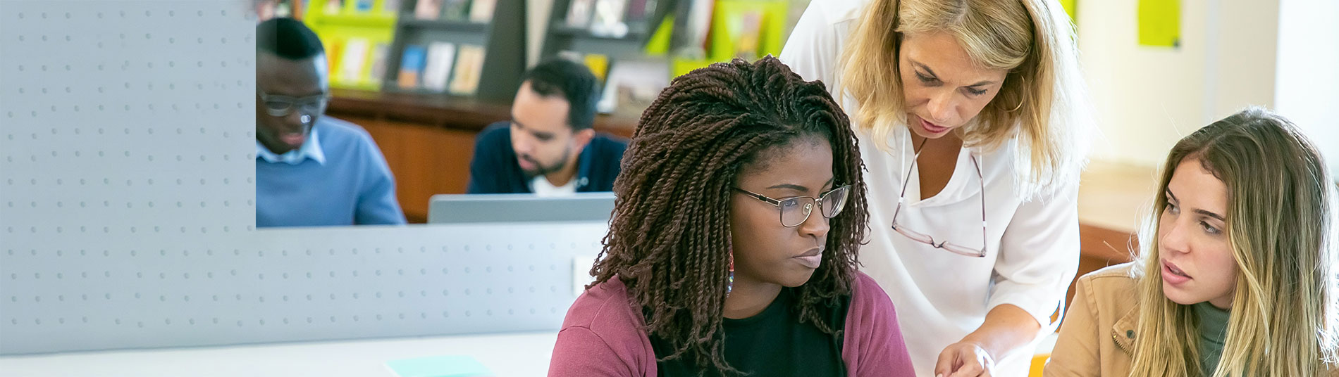 teacher working with students