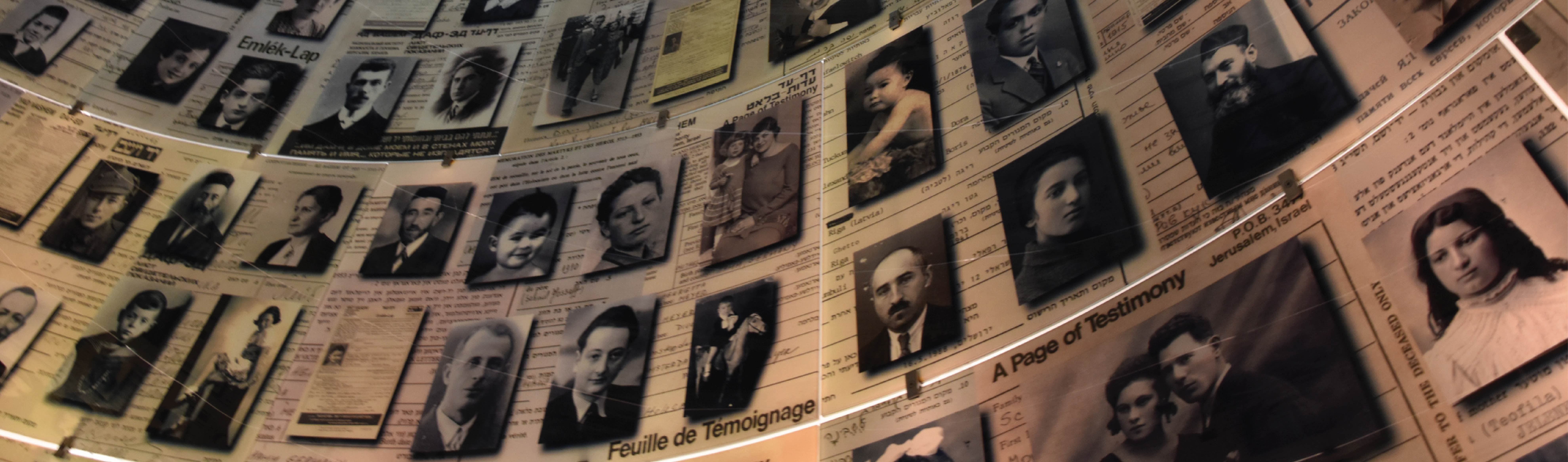 Photos of Jewish people framed on a memorial wall