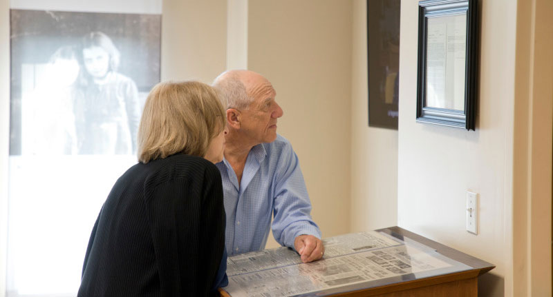 two people viewing artwork