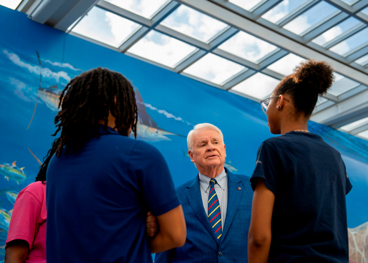 Dr. Moon talking to students