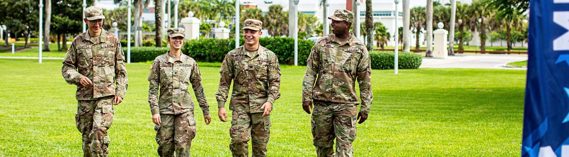 NSU students in army fatigues walking on campus
