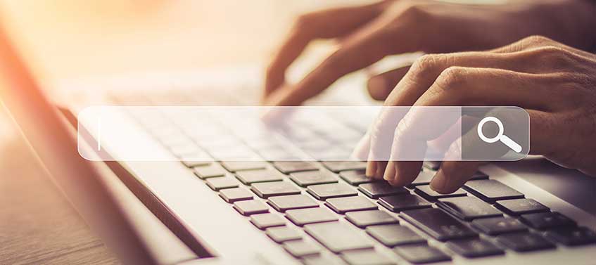 Person searching on laptop
